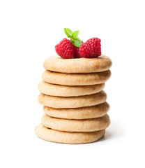 stack  of homemade cookies with raspberries isolated on white background
