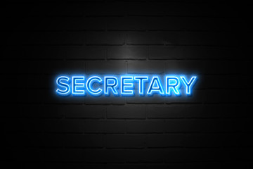 Secretary neon Sign on brickwall