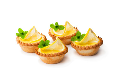 egg  custard tarts with lemon isolated on white