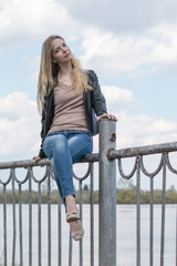 Girl with blond hair on the promenade