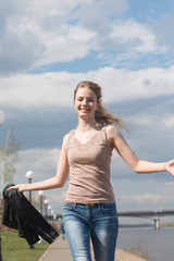 Fototapeta premium Girl with blond hair on the promenade