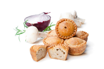 Group  of mini pies with mushroom and onion isolated on white