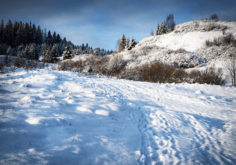 snowy landscape with hills
