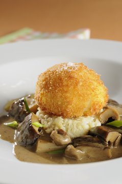 Breaded Egg with Mushrooms sauce