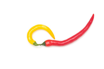 Mix of red and yellow peppers against a white background