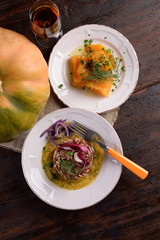 Dishes of risotto and cereals and pumpkin and herbs