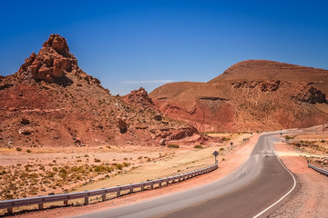 Road through the dry and barren mountain landscape