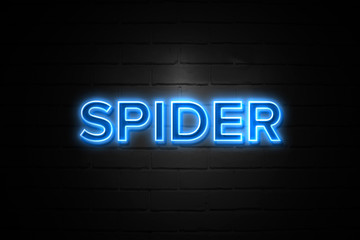 Obraz premium Spider neon Sign on brickwall