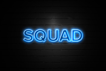 Squad neon Sign on brickwall