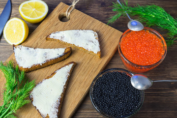 Festive sandwiches with red and black caviar. Healthy and tasty food.