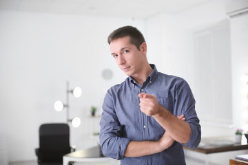 Naklejka premium Portrait of young man in casual clothes indoors