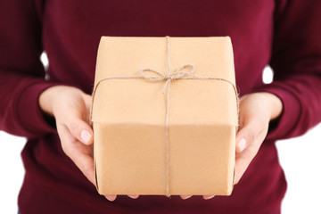 Woman holding parcel gift box, closeup