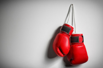 Boxing gloves on light background