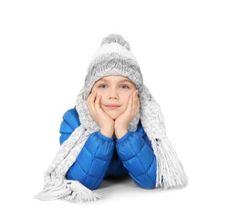 Cute little boy in warm clothing on white background. Ready for winter vacation