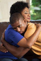 Obraz premium Mother hugging her adult son.