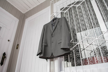 Fototapeta na wymiar Suit hanging on the wall