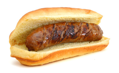 Grilled bratwurst on a bun isolated on white