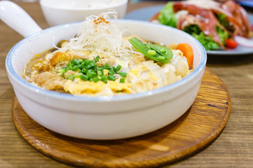Katsudon or Japanese style fried pork roast with egg and Japanese ingredient mixed on rice ready to serve in restaurant