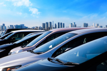 Blue sky and lined up vehicles.