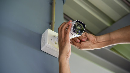 Teachnician installing CCTV camera System for security area.