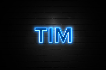 Tim neon Sign on brickwall