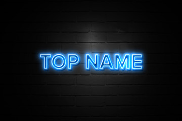 Obraz premium Top Name neon Sign on brickwall