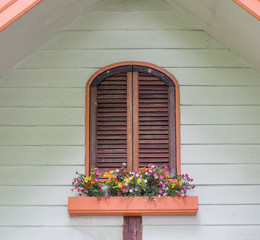 Fototapeta na wymiar Brown window wooden with flower decoration