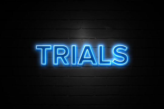 Trials neon Sign on brickwall