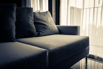 contemporary interior of Living room with part of sofa in sunny day and white curtain interior background concept