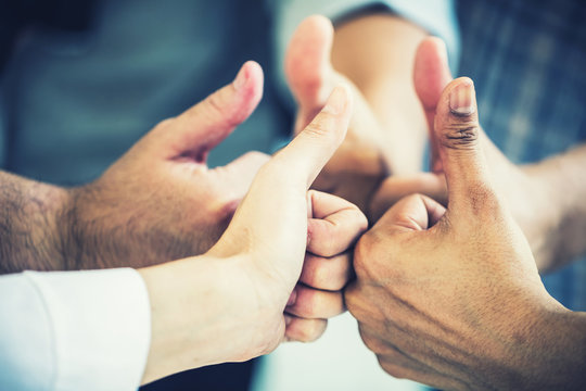 group of business teamwork hand togetrher with thumbs up for successful deal and concept