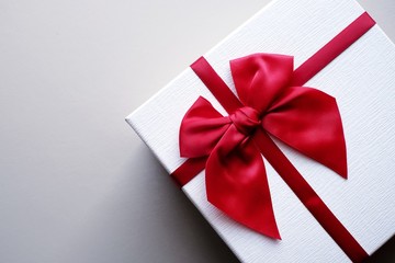  Valentine present. Gift box and red ribbon for romantic couple.