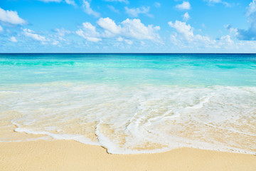 Clear aqua blue sea water and white sand tropical beach