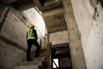 Fototapeta premium professional engineer worker at the house building construction site