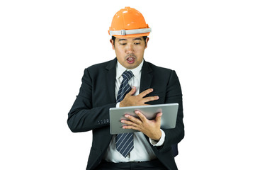 businessman wear safety helmet were shock after look at tablet