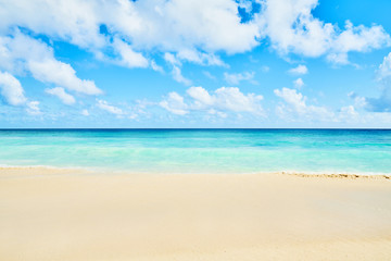 Fototapeta na wymiar Clear aqua blue sea water and white sand tropical beach