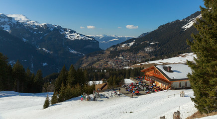 Fototapeta na wymiar tourist people at ski resort with snow and mountain background