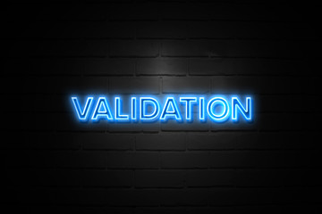 Validation neon Sign on brickwall