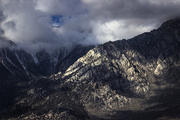 Fototapeta na wymiar Sunny Mountain Ridge with Overcast Skies in the Sierras