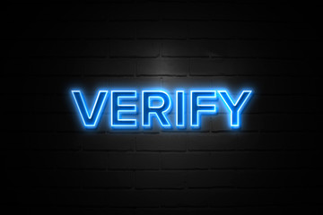 Fototapeta na wymiar Verify neon Sign on brickwall
