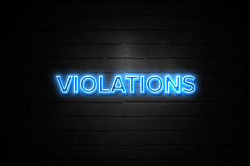 Violations neon Sign on brickwall