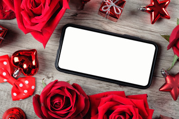 Happy Valentine's Day Concept with red roses, gift boxes, smartphone and space for text