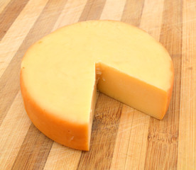 Cheese isolated on wooden board