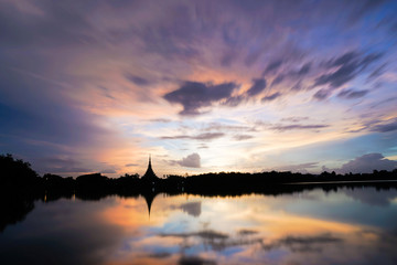 Fototapeta na wymiar Silhouette temple and river in thailand khonkaen landmarks in evening, reflection