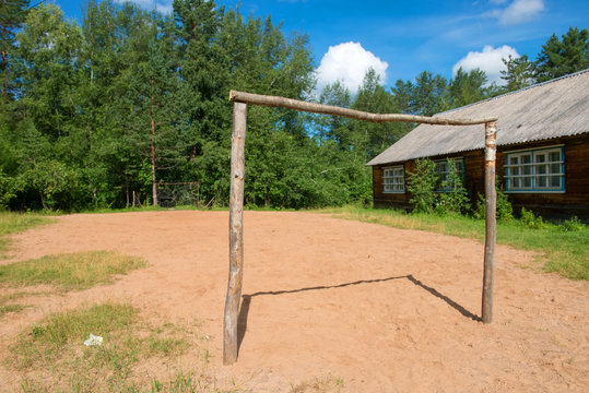 Rustic football field with homemade wooden gates