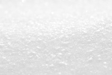 White shiny snow. Background with a texture of snowflakes.