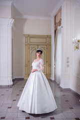 Fototapeta premium Beautiful bride in wedding dress