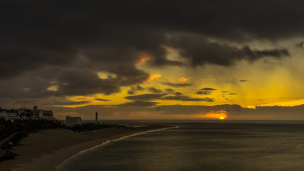 Coast of Jandia Fuerteventura at sunset and dark clouds