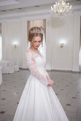 Fototapeta premium Beautiful bride in white interior