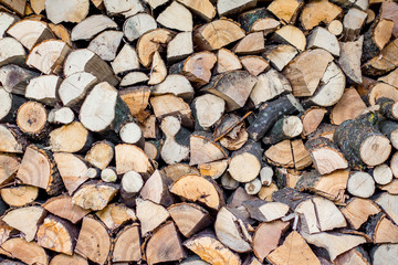 neatly stacked firewood, fuel in the cold winter, a pattern for creativity_