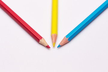 three pencils of yellow, red and blue, the primary colors